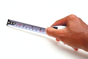 Hand holding meter roll on white background