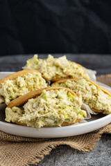 Venezuelan arepa Reina Pepiada stuffed with shredded chicken and creamy avocado. Authentic Latin street food with traditional homemade flavor