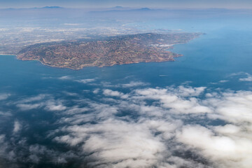 Aerial view of the Palo Verde Peninsula, California, showcasing rugged coastal terrain surrounded by the Pacific Ocean. 