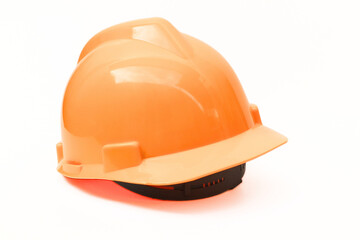 Yellow helmet for construction project on white background
