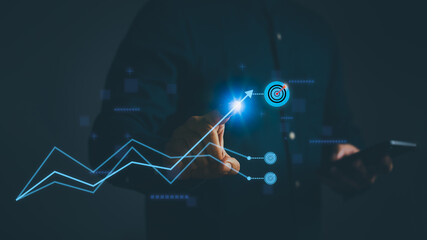 Business growth strategy concept with hand touching upward digital graph targeting success goals....