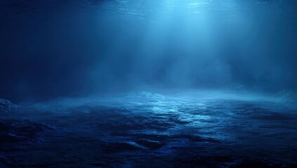 Deep blue underwater scene with light beams