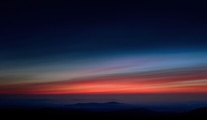 A vibrant sunrise over a mountain landscape