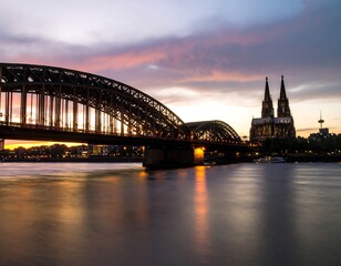 Fototapeta premium City bridge at sunset over river