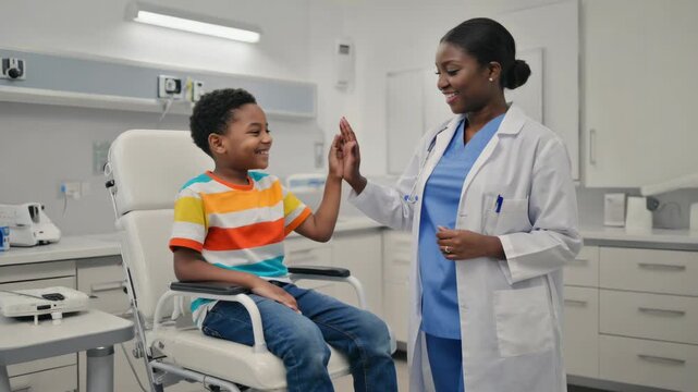Friendly dentist greeting young boy after a successful checkup, symbolizing trust and care in the healthcare industry.