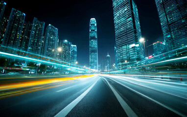 Naklejka premium Blurred light trails on city road at night with tall buildings