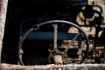 The car after it caught fire. Some parts of the car appear charred.