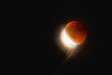 Lunar Eclipse on Sunday 7 September, 2025. The Moon emerges from the Earth's shadow, and causes an...