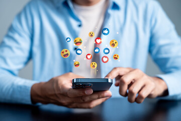 Social media engagement with user interacting on smartphone. emoji digital communication, online...