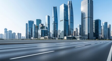 Naklejka premium Modern city skyline with wide road in foreground