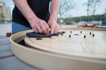 Strategic Game Pieces on a Wooden Board crokinole. 