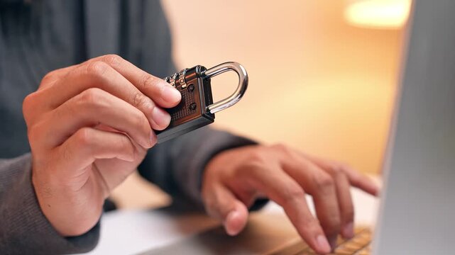 With a lock in hand, a masked hacker represents the ongoing battle between cyber attackers and security systems. The image reflects password breaches, encryption challenges, and digital safety risks.
