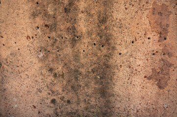 Full frame shot of an earthen wall texture of clay house structure. These walls are constructed by ramming a mixture of aggregates, including gravel, sand, silt and a small amount of clay.