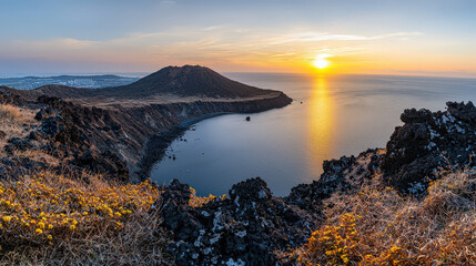 Breathtaking panoramic view of Seongsan Ilchulbong Peak at sunrise, showcasing vibrant colors of sky reflecting on calm sea