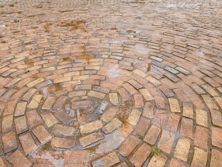 Wet Circular Brick Pavement Pattern After Rain