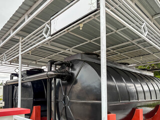 Large Black Wastewater Tank with Pipe Installation at Hospital