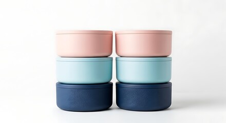 Stack of colorful metal tin containers with lids on white backdrop showcasing product and color variety for storage solutions