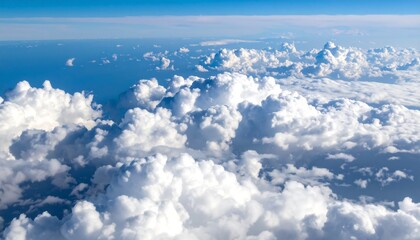 Aerial view of fluffy white clouds over a vast blue expanse