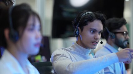 A diverse team of customer support agents works in a modern call center. Smiling operators assist clients over the phone, providing helpful and professional technical support. - Powered by Adobe