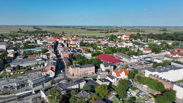Aerial Strzelno Poland city center pull. Central north Poland. German occupation World War II. Farm rural area. Historical trade and religious center. Historic buildings rural village.