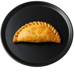 Golden pastry treat on a dark plate isolated on white background