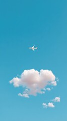 Airplane soaring high above a fluffy cloud in a bright blue sky, creating a sense of freedom and open space. Soft, natural lighting