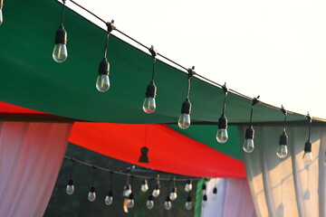 vintage light bulb hang on equipment of party in the evening