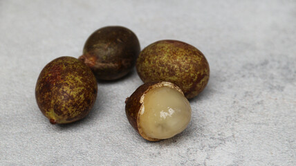 Matoa (Pometia pinnata) on grey background