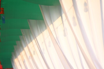 white, green and red curtain decorate for party in the garden