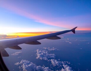 Fototapeta premium Airplane wing with clouds and sunset outside the window