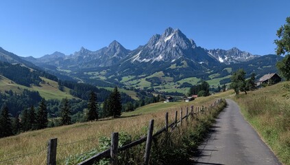 Alpine valley road leading to a snow-capped peak