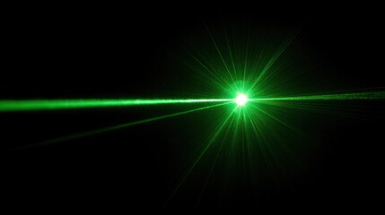 A green laser beam shining in the dark.