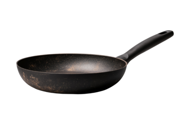 A vintage frying pan with a worn surface, isolated on a white background, perfect for culinary presentations.