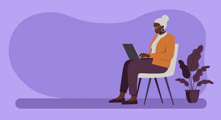 Senior Black woman actively engaging with technology, sitting on a chair and using a laptop. Represents digital literacy, remote work, or modern lifestyle for older adults.