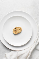 Overhead view of toasted bread chips on white background, top view of crostini bread on marble countertop