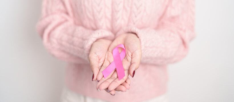 Pink October Breast Cancer Awareness month, woman with pink Ribbon for concepts of support people life and illness. National cancer survivors month, Women Health day and February World cancer day