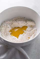 top view of spicy cracker dough being mixed in a bowl, process of making fire crackers
