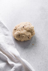 Overhead view of fire crackers dough on parchment paper, top view of spicy cracker dough, process of making fire crackers