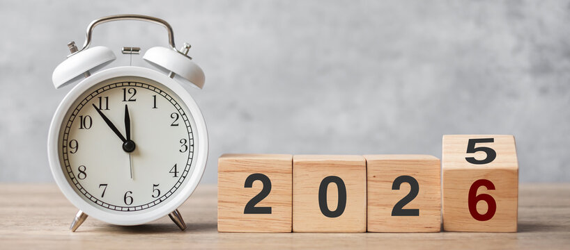 Happy New Year with vintage alarm clock and flipping 2025 change to 2026  block. Christmas, New Start, Resolution, countdown, Goals, Plan, Action and Motivation Concept