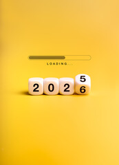 Loading bar with flipping white dices changing from 2025 to 2026 on yellow background, symbolizing new year countdown, upcoming design trends, fresh start, innovation, and future opportunities.