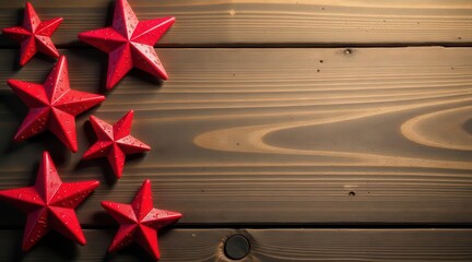 Red star decorations arranged on dark wood background