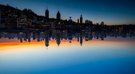 Naklejka premium Surreal city skyline mirrored upside down, creating an abstract and artistic urban reflection at twilight with vibrant sky