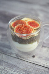 Delicious chia pudding topped with fresh figs and nuts