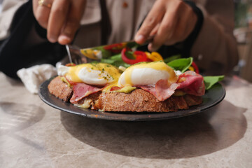 Enjoying a delicious brunch with eggs and greens