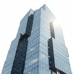 Obraz premium A modern glass skyscraper rises dramatically against a plain white background, showcasing its geometric facade and reflecting the light.