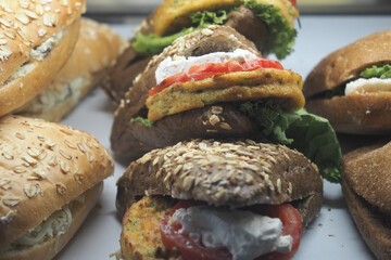 Freshly made sandwiches displayed in a bakery cabinet