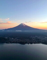 Fototapeta premium Majestic mountain at sunset, serene lake view