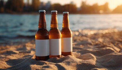 Three brown beer bottles on a sandy beach at sunset (1)