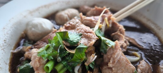 Pork waterfall noodles in a white plate