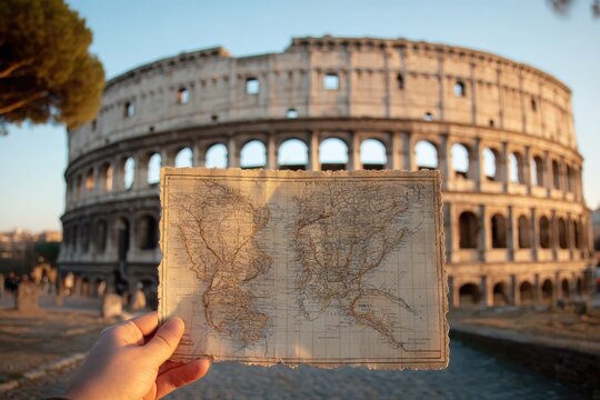 Ancient map held in front of Colosseum
